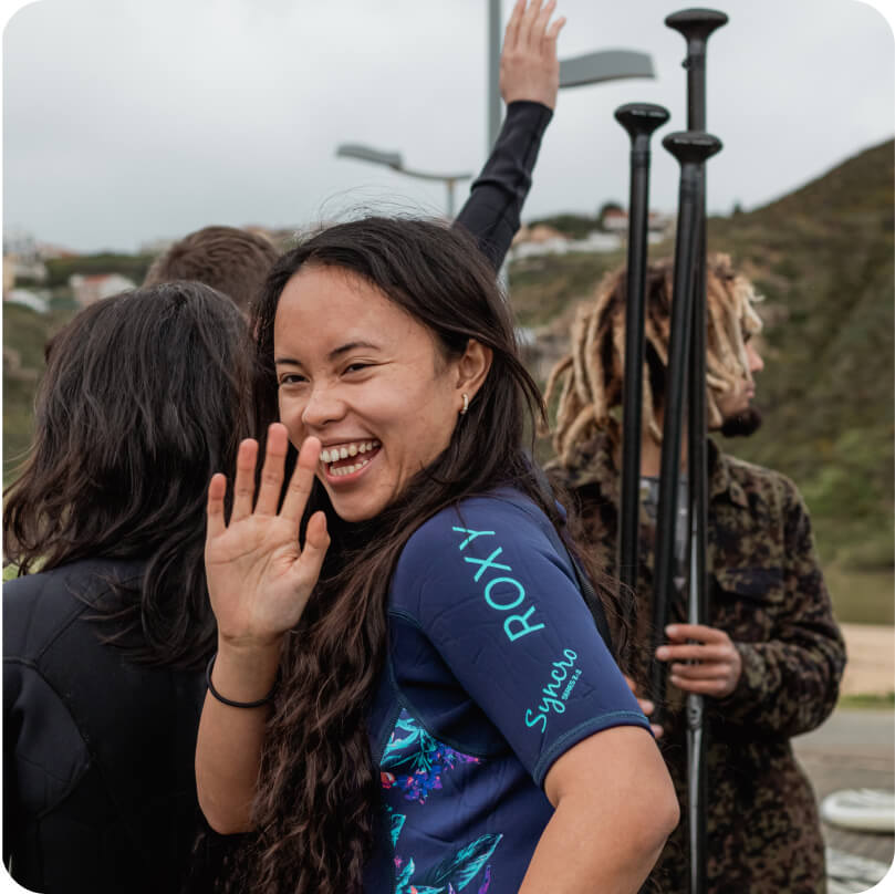 A Gitpod team member waving and smiling.