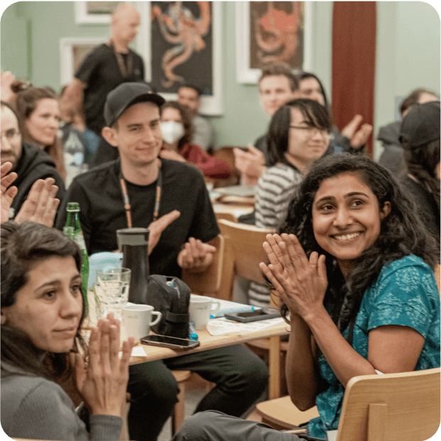 Gitpod team members clapping.